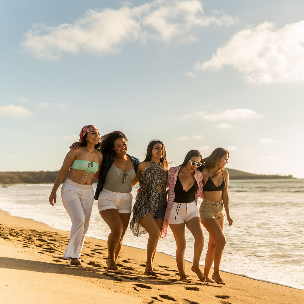 group of 5 women at the beach, on a beautiful sunny day