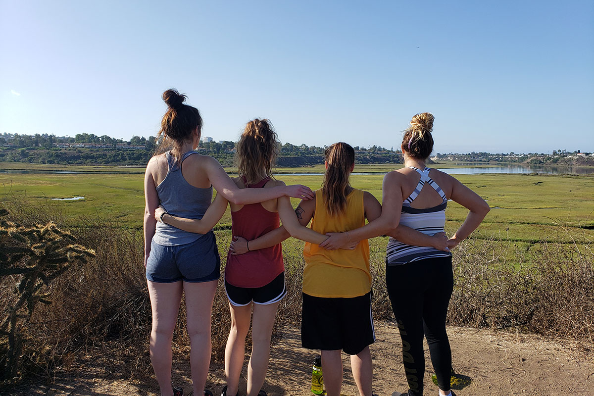group of women standing on an overlook