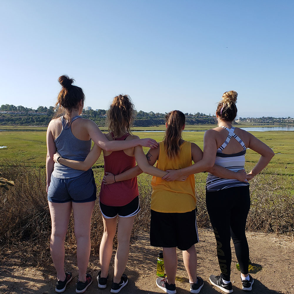 group of women standing on an overlook