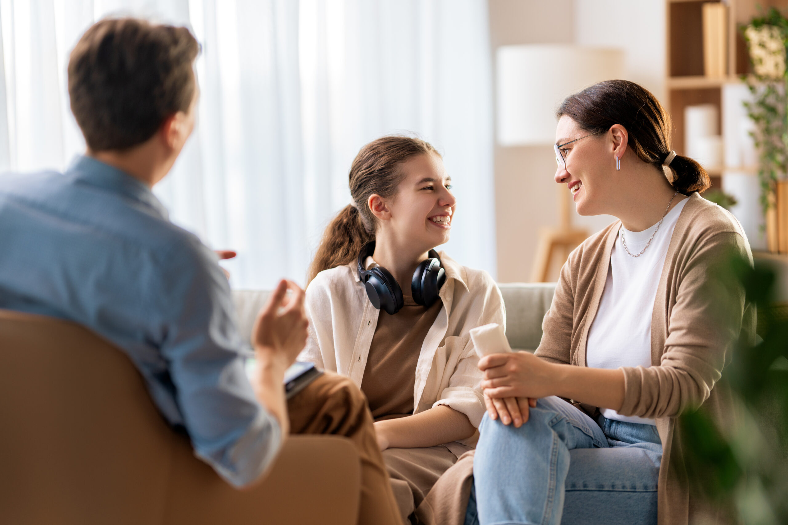 Family smiling during therapy session