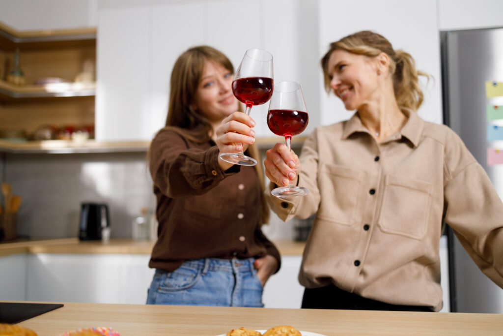 Women toasting wine symbolizing wine mom culture