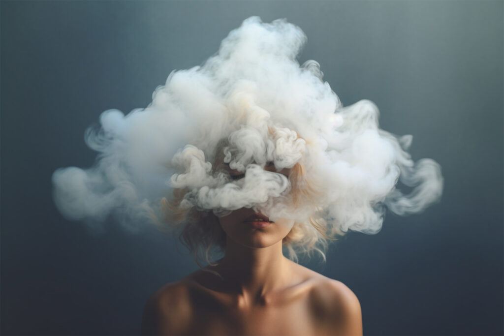 Woman’s head covered in smoke, symbolizing dual diagnosis.