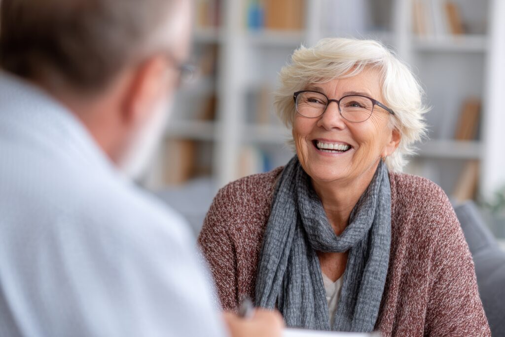 Smiling-senior-woman-listening-about-her-advance-in-therapy