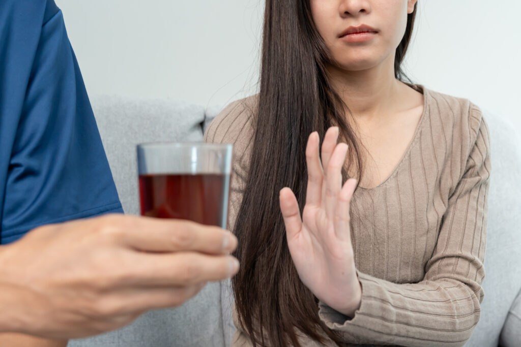 Woman refuses drinking alcohol beverage