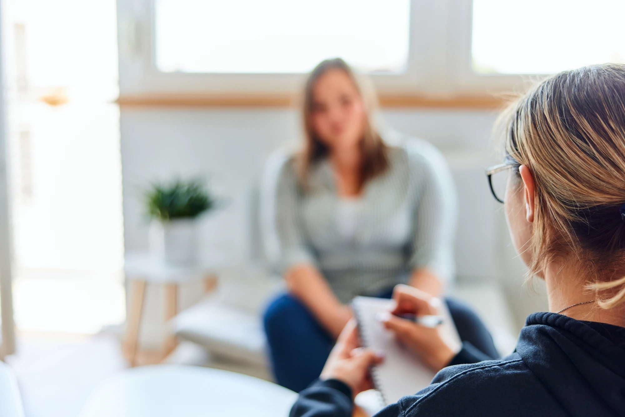 Woman talking with a clinician during an eating disorder assessment