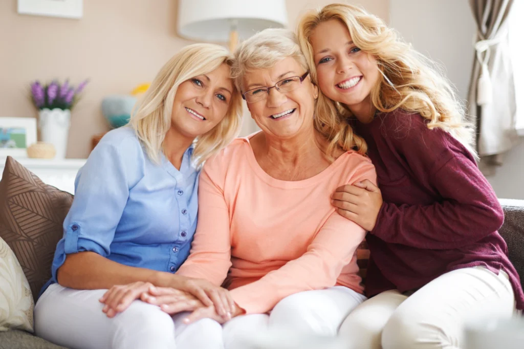 Three generations of women sitting together at home